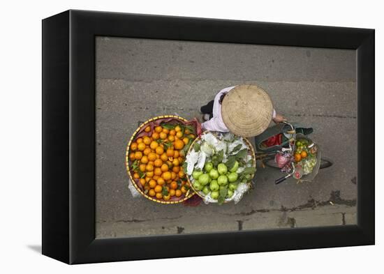 Street vendor with baskets of fruit on bicycle, Old Quarter, Hanoi, Vietnam-David Wall-Framed Premier Image Canvas