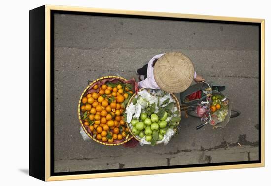 Street vendor with baskets of fruit on bicycle, Old Quarter, Hanoi, Vietnam-David Wall-Framed Premier Image Canvas