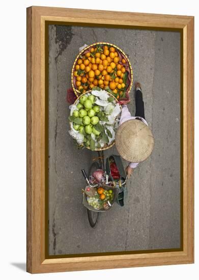 Street vendor with baskets of fruit on bicycle, Old Quarter, Hanoi, Vietnam-David Wall-Framed Premier Image Canvas