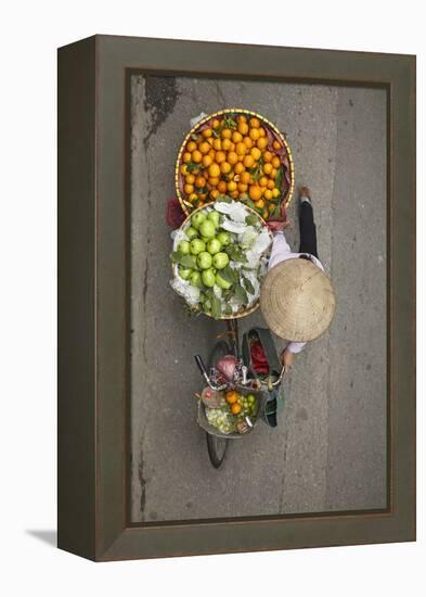 Street vendor with baskets of fruit on bicycle, Old Quarter, Hanoi, Vietnam-David Wall-Framed Premier Image Canvas