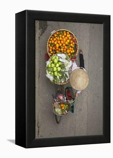 Street vendor with baskets of fruit on bicycle, Old Quarter, Hanoi, Vietnam-David Wall-Framed Premier Image Canvas