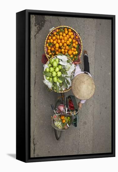 Street vendor with baskets of fruit on bicycle, Old Quarter, Hanoi, Vietnam-David Wall-Framed Premier Image Canvas