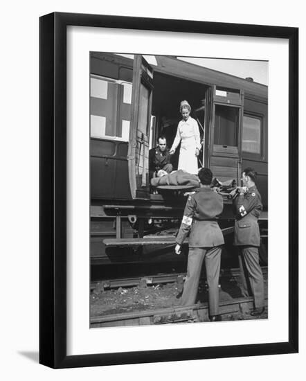 Stretcher Men Passing in a Case to Be Checked by Army Nurse-null-Framed Photographic Print