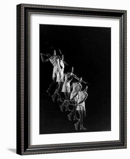 Stroboscopic Image of Woman Swinging Tennis Racquet as She Appears to Be Descending Staircase-Gjon Mili-Framed Photographic Print