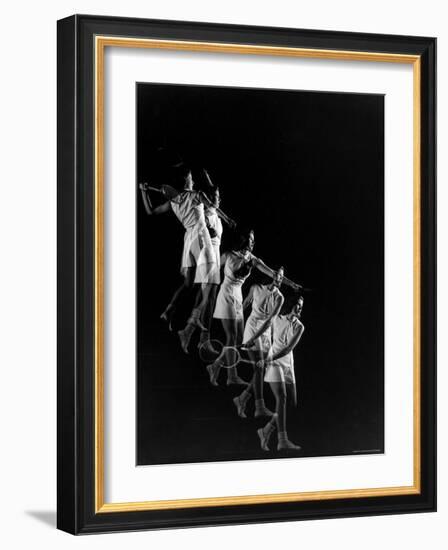 Stroboscopic Image of Woman Swinging Tennis Racquet as She Appears to Be Descending Staircase-Gjon Mili-Framed Photographic Print