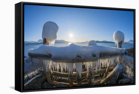 Strongly iced pier with sun in winter, Nordbotn, Tromso, Troms, Norway-Raimund Linke-Framed Stretched Canvas