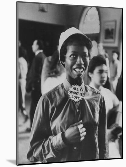 Student Wearing Hat and Button on Shirt That Says: All I Want is Love on "Old Clothes Day"-Gordon Parks-Mounted Photographic Print