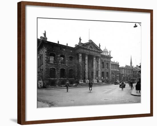 Students and Traffic Passing Administrative Building at Oxford University-null-Framed Photographic Print