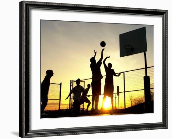Students Play a Basketball Game as the Sun Sets at Bucks County Community College--Framed Photographic Print