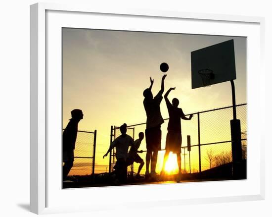 Students Play a Basketball Game as the Sun Sets at Bucks County Community College--Framed Photographic Print