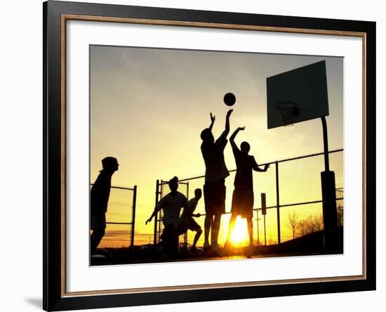 Students Play a Basketball Game as the Sun Sets at Bucks County Community College--Framed Photographic Print