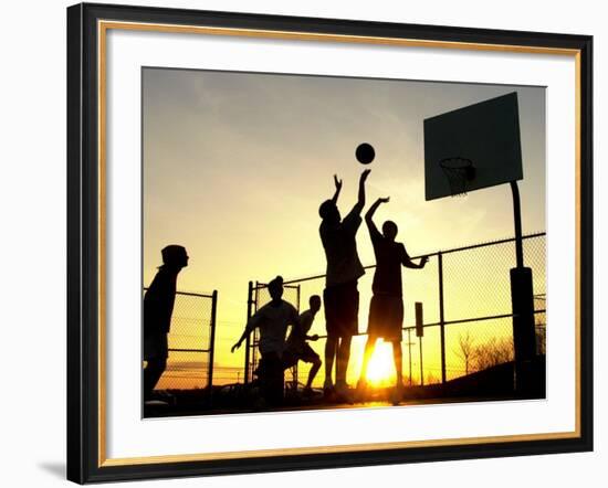 Students Play a Basketball Game as the Sun Sets at Bucks County Community College--Framed Photographic Print