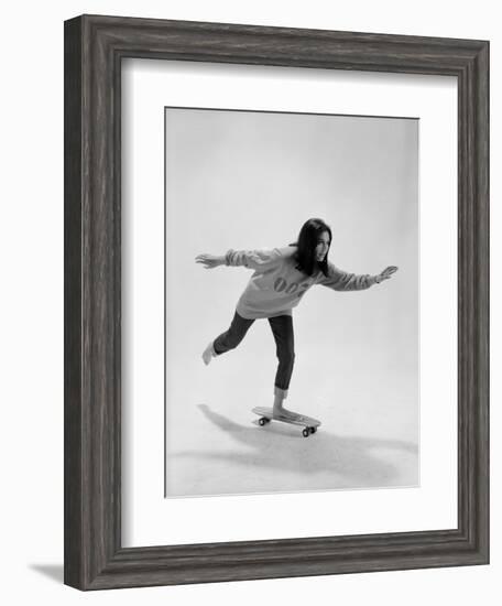 Studio Photos of Gloria Steinem Riding a Skateboard with a 007 James Bond Sweatshirt, 1965-Yale Joel-Framed Photographic Print