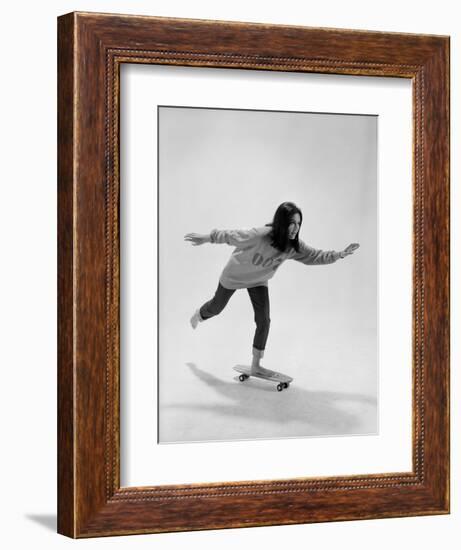 Studio Photos of Gloria Steinem Riding a Skateboard with a 007 James Bond Sweatshirt, 1965-Yale Joel-Framed Photographic Print