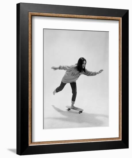 Studio Photos of Gloria Steinem Riding a Skateboard with a 007 James Bond Sweatshirt, 1965-Yale Joel-Framed Photographic Print