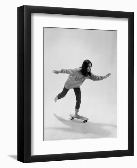 Studio Photos of Gloria Steinem Riding a Skateboard with a 007 James Bond Sweatshirt, 1965-Yale Joel-Framed Photographic Print