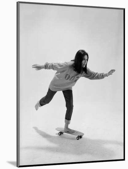 Studio Photos of Gloria Steinem Riding a Skateboard with a 007 James Bond Sweatshirt, 1965-Yale Joel-Mounted Photographic Print