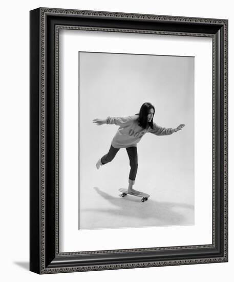 Studio Photos of Gloria Steinem Riding a Skateboard with a 007 James Bond Sweatshirt, 1965-Yale Joel-Framed Photographic Print