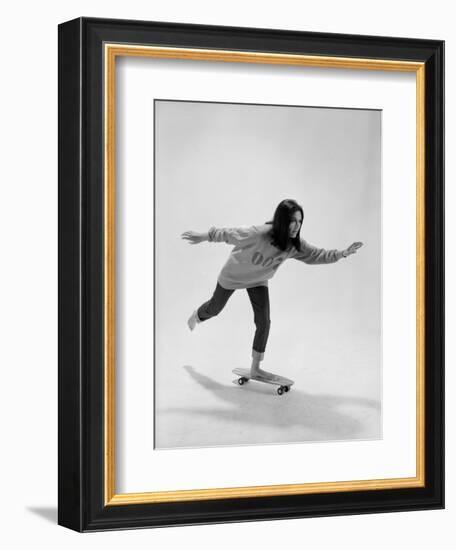 Studio Photos of Gloria Steinem Riding a Skateboard with a 007 James Bond Sweatshirt, 1965-Yale Joel-Framed Photographic Print