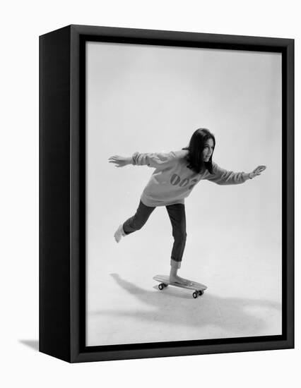 Studio Photos of Gloria Steinem Riding a Skateboard with a 007 James Bond Sweatshirt, 1965-Yale Joel-Framed Premier Image Canvas