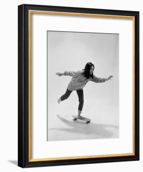 Studio Photos of Gloria Steinem Riding a Skateboard with a 007 James Bond Sweatshirt, 1965-Yale Joel-Framed Premium Photographic Print