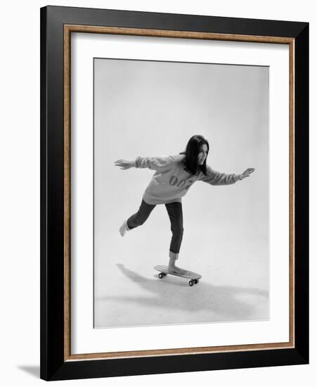 Studio Photos of Gloria Steinem Riding a Skateboard with a 007 James Bond Sweatshirt, 1965-Yale Joel-Framed Premium Photographic Print
