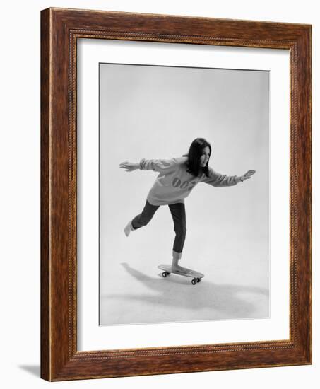 Studio Photos of Gloria Steinem Riding a Skateboard with a 007 James Bond Sweatshirt, 1965-Yale Joel-Framed Photographic Print