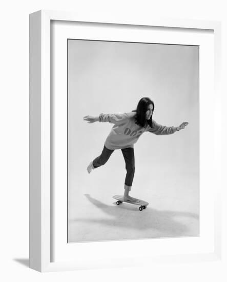 Studio Photos of Gloria Steinem Riding a Skateboard with a 007 James Bond Sweatshirt, 1965-Yale Joel-Framed Photographic Print