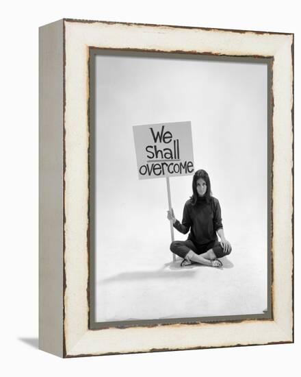 Studio Photos of Gloria Steinem Sitting on Floor with Sign That Says 'We Shall Overcome", 1965-Yale Joel-Framed Premier Image Canvas