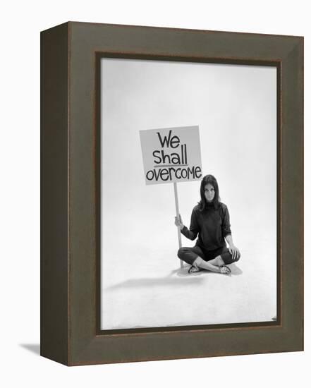 Studio Photos of Gloria Steinem Sitting on Floor with Sign That Says 'We Shall Overcome", 1965-Yale Joel-Framed Premier Image Canvas