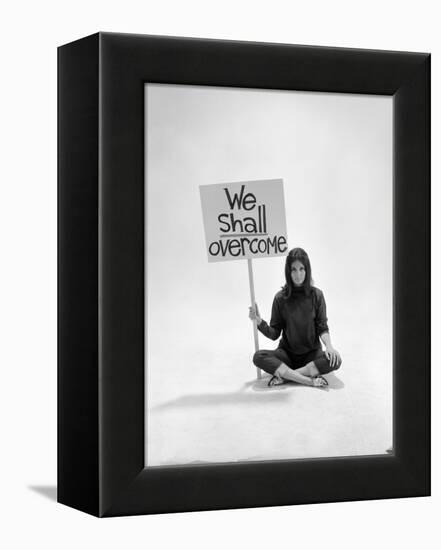 Studio Photos of Gloria Steinem Sitting on Floor with Sign That Says 'We Shall Overcome", 1965-Yale Joel-Framed Premier Image Canvas