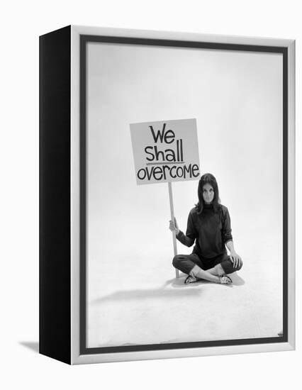 Studio Photos of Gloria Steinem Sitting on Floor with Sign That Says 'We Shall Overcome", 1965-Yale Joel-Framed Premier Image Canvas