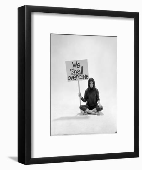 Studio Photos of Gloria Steinem Sitting on Floor with Sign That Says 'We Shall Overcome", 1965-Yale Joel-Framed Photographic Print