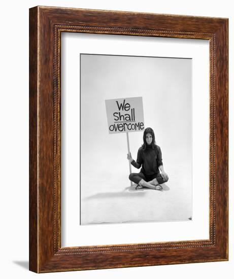 Studio Photos of Gloria Steinem Sitting on Floor with Sign That Says 'We Shall Overcome", 1965-Yale Joel-Framed Premium Photographic Print