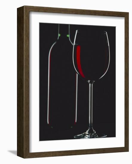 Studio Shot of Back-Lit Glass and Bottle of Red Wine-Lee Frost-Framed Photographic Print