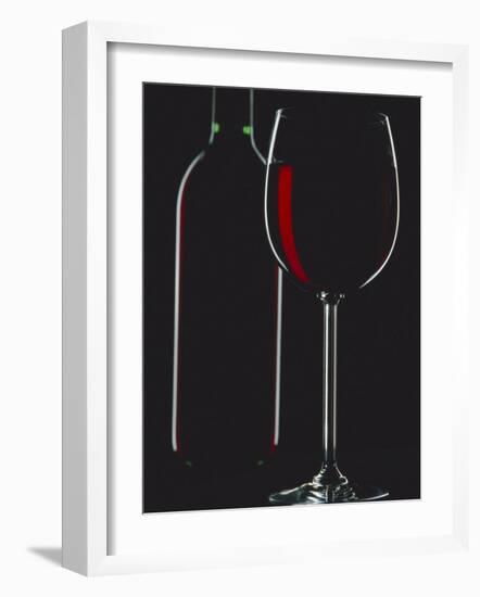 Studio Shot of Back-Lit Glass and Bottle of Red Wine-Lee Frost-Framed Photographic Print