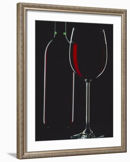 Studio Shot of Back-Lit Glass and Bottle of Red Wine-Lee Frost-Framed Photographic Print