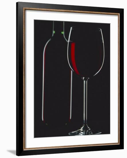 Studio Shot of Back-Lit Glass and Bottle of Red Wine-Lee Frost-Framed Photographic Print