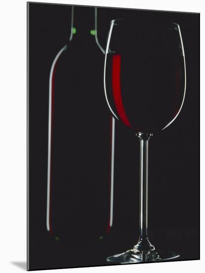 Studio Shot of Back-Lit Glass and Bottle of Red Wine-Lee Frost-Mounted Photographic Print