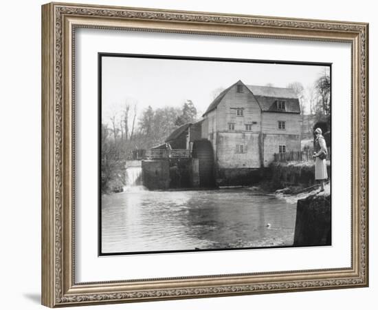 Stylish Woman Well Wrapped up for a Cold Day Stops to Admire Castle Mill Dorking Surrey England-null-Framed Art Print