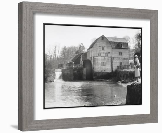 Stylish Woman Well Wrapped up for a Cold Day Stops to Admire Castle Mill Dorking Surrey England-null-Framed Art Print