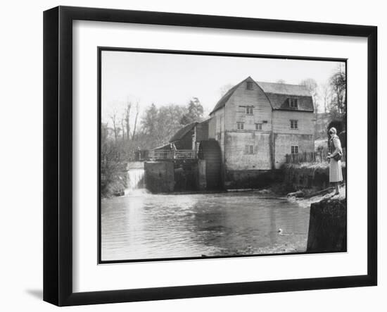 Stylish Woman Well Wrapped up for a Cold Day Stops to Admire Castle Mill Dorking Surrey England-null-Framed Art Print