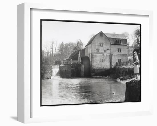 Stylish Woman Well Wrapped up for a Cold Day Stops to Admire Castle Mill Dorking Surrey England-null-Framed Art Print