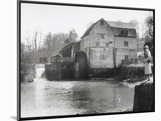 Stylish Woman Well Wrapped up for a Cold Day Stops to Admire Castle Mill Dorking Surrey England-null-Mounted Art Print