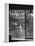 Suburban Housewife Hanging Out a Bit of Laundry, Seen Through Window in typical California Home-Loomis Dean-Framed Premier Image Canvas