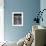 Suburban Housewife Hanging Out a Bit of Laundry, Seen Through Window in typical California Home-Loomis Dean-Framed Photographic Print displayed on a wall