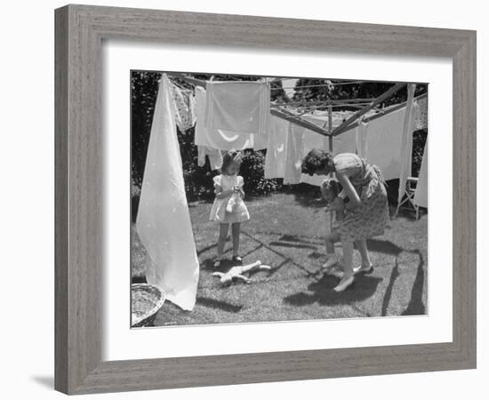 Suburban Mother Playing with Her Two Daughters While Hanging Laundry in Backyard-Alfred Eisenstaedt-Framed Photographic Print
