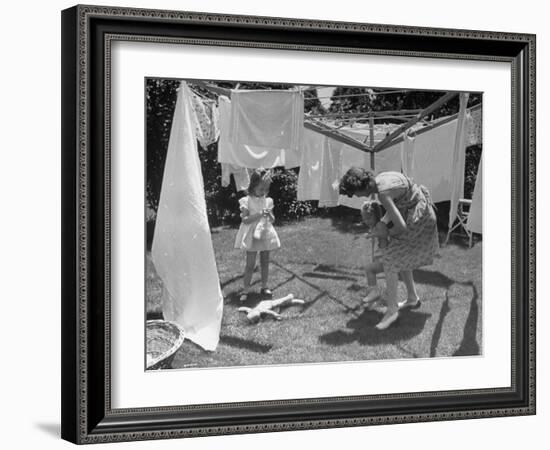 Suburban Mother Playing with Her Two Daughters While Hanging Laundry in Backyard-Alfred Eisenstaedt-Framed Photographic Print