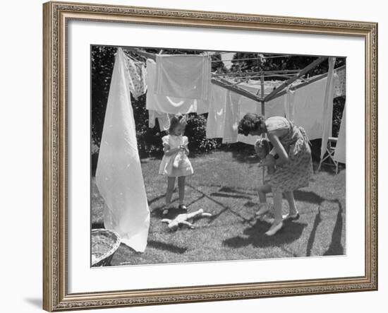 Suburban Mother Playing with Her Two Daughters While Hanging Laundry in Backyard-Alfred Eisenstaedt-Framed Photographic Print