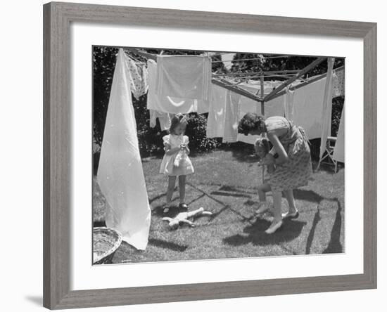 Suburban Mother Playing with Her Two Daughters While Hanging Laundry in Backyard-Alfred Eisenstaedt-Framed Photographic Print